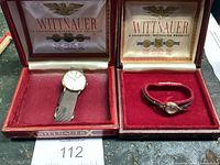 Both watches displayed in original red Wittnauer boxes