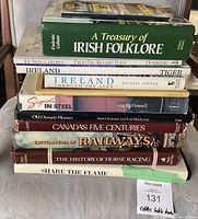 Stack of 10 hardcover coffee table books, showing titles including Irish folklore, Ireland, Maple, Steel, Old Ontario, Canadian history, railways, horse racing.