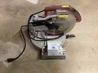 Top and side views of Tool Shop compound miter saw showing overall condition, blade, handle, and power cord.