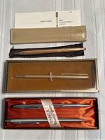 Wide view of all Parker pens with original boxes and paperwork.