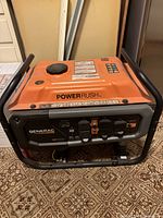 Front angle view of entire generator showing frame, tank, control panel