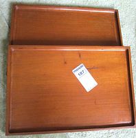 Two rectangular wooden trays stacked side by side showing top surfaces and finish.