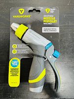 Photo showing one Yardworks adjustable nozzle pistol sprayer in original retail packaging featuring yellow, gray, and blue components and packaging details.