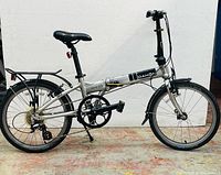 Unfolded side view showing full frame, drivetrain, wheels and rack