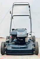 Front view showing deck, wheels, and engine cover