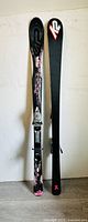 Pair of K2 skis showing top and bottom surfaces along with bindings.