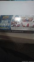 Photo of the unopened 2020-2021 Upper Deck NHL Star Rookies Box Set showing the box design, NHL rookie players, and branding.