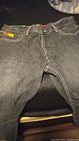 Image shows a pair of Pepe Jeans men's denim jeans laid flat, size 36 waist and 34 length, in a washed black/grey color with white stitching and a label on the waistband.