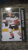 Front side of the Trevor Zegras Young Guns card showing the player in Anaheim Ducks uniform skating on the ice.