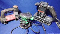 Show Craftsman sander, Hitachi sander, Bonaire inflator together with cords
