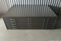 Front view of closed cabinet showing full five-drawer face