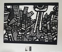 Front view of black and white graffiti street art canvas painting depicting a dense cityscape.