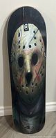 Full view of skateboard deck showing Jason Voorhees mask graphic from Friday the 13th in realistic color, condition great.