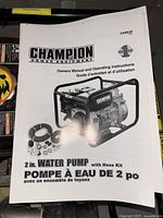 Cover of Champion C44025 owner’s manual showing 2" water pump and hose kit