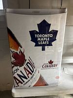 Exterior image showing white Danby refrigerator door with Toronto Maple Leafs and Molson Canadian graphics decal.