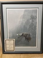 Frontal view of the framed print showing overall condition, framing, matting, and subject matter
