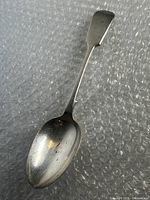 Full view of silver plated spoon showing overall condition and shape