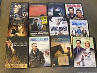 DVD cases in their original covers showing titles and artwork for 11 different movies