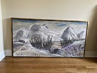 Framed acrylic landscape painting showing snowy mountain scene with pine trees and muted purple flowers.