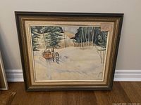 Full view of the framed winter scene painting showing horse and sleigh in a snowy forest.