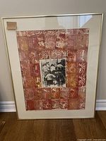 Front view of framed print showing abstract grid design and central black and white image.