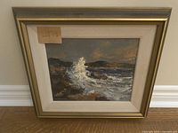 Front view of the framed painting showing the seascape and frame