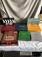 Full view of all game boxes showing variety and condition.