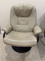 Front view of entire chair showing seat, backrest, armrests and base