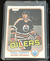 Front side of the 1981-82 O-Pee-Chee Paul Coffey Edmonton Oilers hockey trading card showing player image and team design.