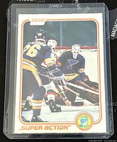 Front view of 1981-82 O-Pee-Chee Super Action hockey trading card featuring goalie Mike Liut in action with St. Louis Blues uniform, captured in game scene.
