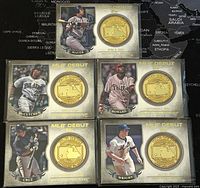 Set of five 2016 Topps MLB Debut Medallions collectible cards displayed on a world map background. Each card features a player photo, a gold medallion with debut info, and the player's name and team.