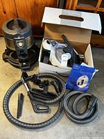 Main unit and accessories arranged on floor, showing condition and included parts