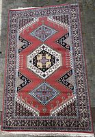 Full view of the rectangular area rug showing the overall geometric design and color scheme.