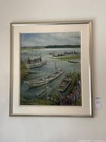 Full view of the original oil painting framed and hung on wall showing several boats on water.