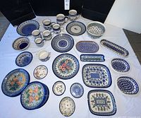 Overhead view of all pottery pieces laid out on white cloth