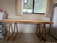 Front view of full table showing tabletop, leg style and overall structure