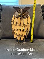 Photo showing one owl figurine with wood and metal construction, standing about 14 inches tall as measured with a tape measure.