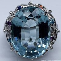 Front view showing oval aquamarine and accent stones