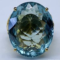 Front view of ring showing large oval aquamarine solitaire