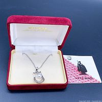 Necklace and presentation box with certificate card