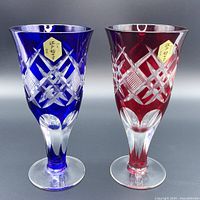 Front view of blue and red Edo Kiriko cut glasses showing decorative cuts and labels.