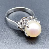 Angled view showing the pearl, band and setting