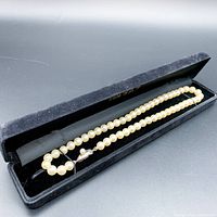 Pearl necklace in black velvet jewelry box