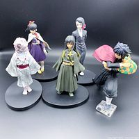 Group photo showing all 5 anime figurines in various poses and costumes.