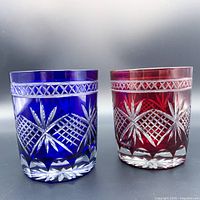 Front view of red and blue Edo Kiriko tumblers showing traditional cut patterns