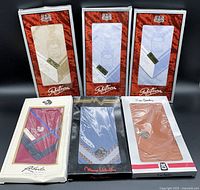 Lot contents showing all six assorted cotton handkerchiefs in original boxes, various brands and colors visible.