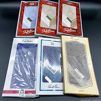 View of all six boxed handkerchiefs showing brands and packaging styles