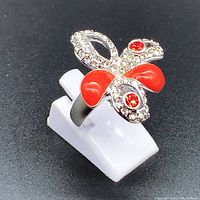 Photo of Swarovski flower ring showing red and clear crystals in flower design on silver band