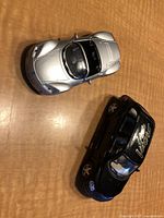 Top view of silver Plymouth Spyder and black Chrysler Cruiser with Viper decal