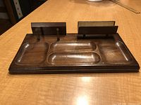 Top and angled view of the wooden gentlemen's bureau valet with multiple compartments, card holders, and fabric-lined section.